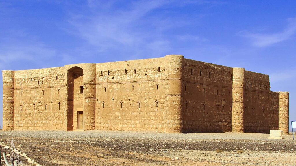 A panoramic photograph immortalizes the square-shaped Qasr Al-Harrana, one of the renowned desert castles.
