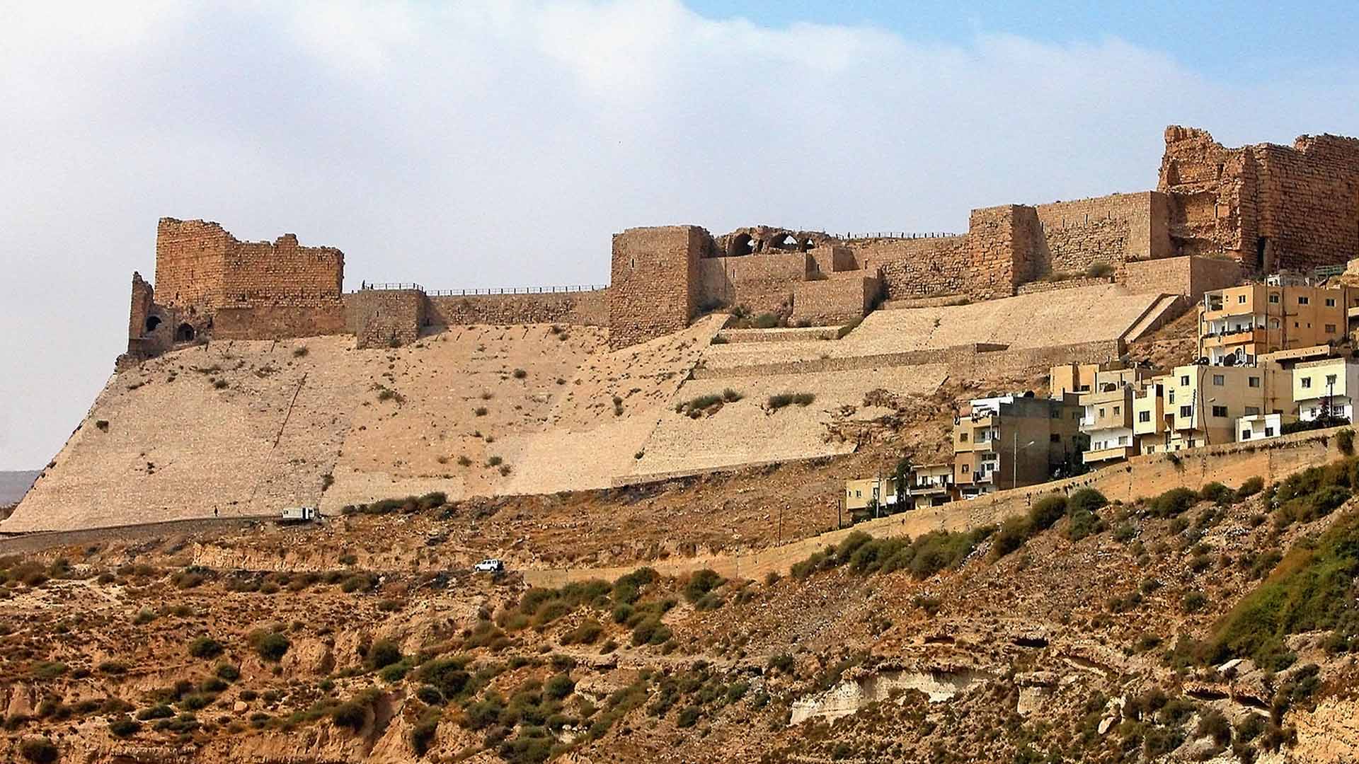 A panoramic photograph immortalizes the formidable Kerak Castle, an imposing fortress from the time of the Crusaders.