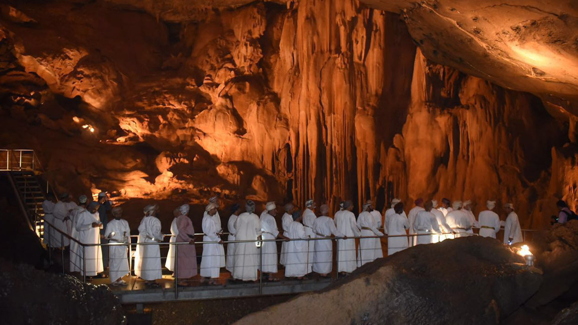 A panoramic photograph immortalizes the captivating natural marvel of Al Hoota Cave, with locals forming a queue in the background, eagerly awaiting their turn to explore this enchanting underground wonder.