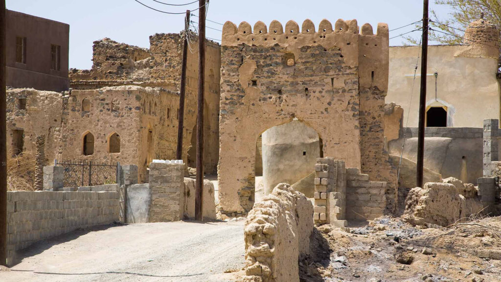 A photograph captures the remarkably preserved mud-brick architecture of Ibra, providing a glimpse into the rich history of the region.