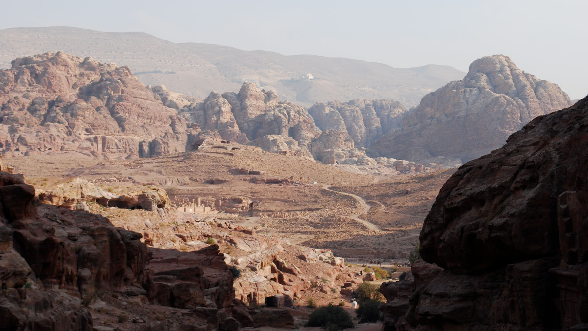 A panoramic photograph immortalizes Jebel Shams, situated in the Al Hajar mountain range, providing awe-inspiring vistas of a majestic mountain range that stretches as far as the eye can see.