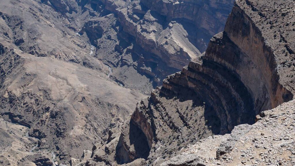 From an aerial perspective, the photograph offers a mesmerizing view of the spectacular and deeply carved canyons of Wadi Nakhr, showcasing nature's awe-inspiring beauty at its finest.