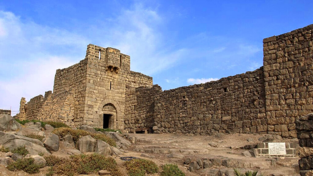 A photograph immortalizes Qasr Al-Azraq in Zarqa, capturing the essence of this historical fortress in its picturesque setting.